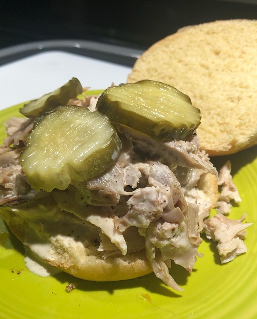 BBQ Chicken sandwich with mayo BBQ sauce and pickles.