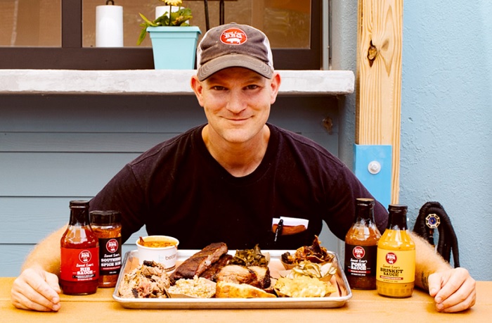 Carolina BBQ Festival founder Lewis Donald with his signature BBQ dishes and sauces.