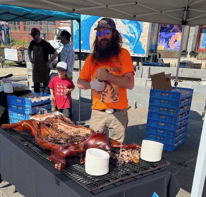 BBQ Pitmaster and Holy City Hogs founder Tank Jackson in his element: whole hog barbecue.