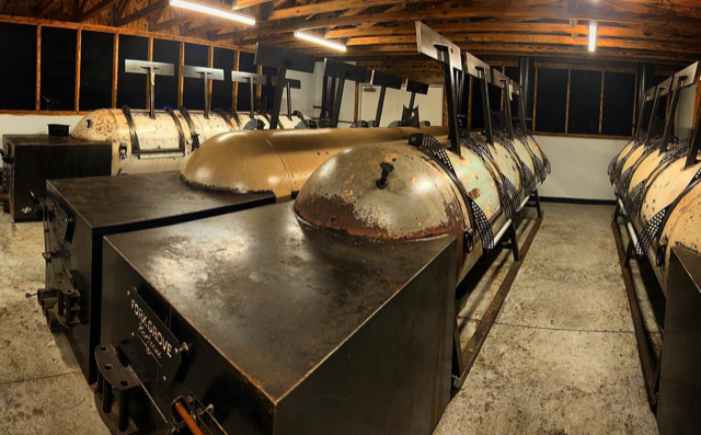 Four thousand-gallon smokers built by Pig Iron Patina.