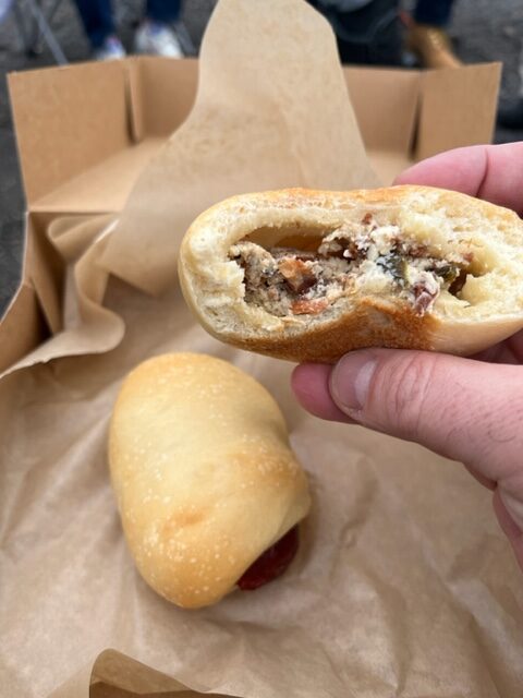 Jon G's Kolaches, one stuffed with a bacon cream cheese mix, one stuffed with sausage.