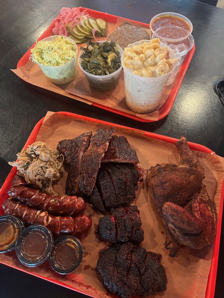 Barbecue tray at Palmira Barbecue, featuring beef cheeks, lower center.